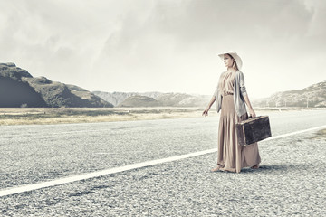 Woman with old suitcase