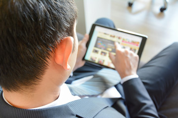 Fototapeta na wymiar Businessman using tablet computer