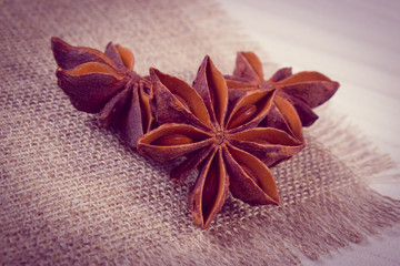 Vintage photo, Star anise spice on white wooden table
