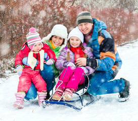 Winter portrait of happy young family