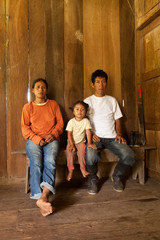 A Quechua family of cocoa farmers in 3rd world Ecuador, living in poverty with their colorful...
