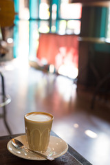 Hot art Latte Coffee in a cup on table
