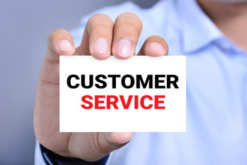 CUSTOMER SERVICE message on the card held by a man hand