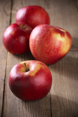 Fototapeta na wymiar Red apples on wood