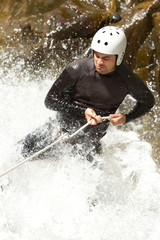 Watch as an experienced adult man skillfully descends a breathtaking Ecuadorian waterfall,showcasing perfect form and technique.