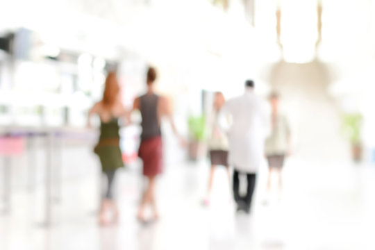 White blur abstract background of people walking in hospital halllway