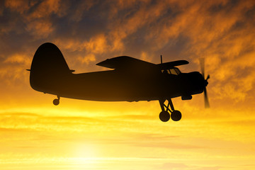 Obraz na płótnie Canvas engine airplane flying at sunset