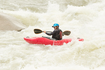 Fototapeta na wymiar An experienced and adventurous kayaker fearlessly conquering the challenges of rough waters.