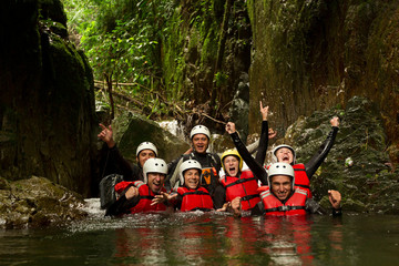 A group of young people led by an instructor embarks on a thrilling canyoning expedition in the...