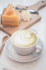 Hot green tea latte, orange cake