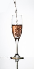pouring champagne into a glass