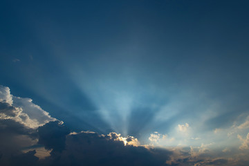 Sunbeam and dramatic sky with cloud at sunset