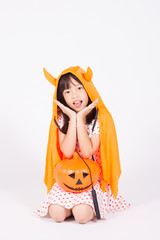 little girl in black hat  with halloween pumpkin