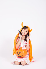 little girl in black hat  with halloween pumpkin