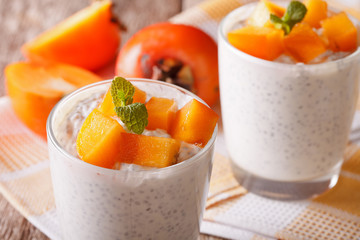 dessert with chia seeds and persimmon in a glass. Horizontal
