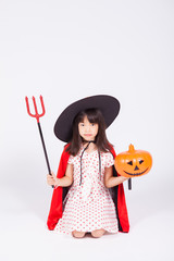 little girl in black hat  with halloween pumpkin