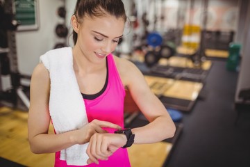 Fit woman using her smartwatch
