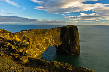 Fototapeta premium Dyrholaey rock at south coast of Iceland near city of Vik