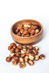 Hazelnuts in a Wooden Bowl on White Background