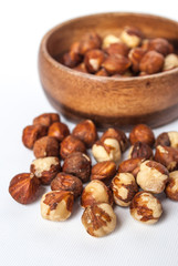 Hazelnuts in a Wooden Bowl on White Background