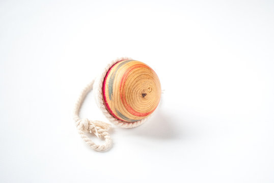 Wooden Pegtop on a White Background