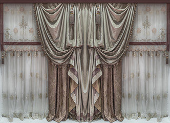 The elegant interior design. Bilateral luxury curtains and tulle.