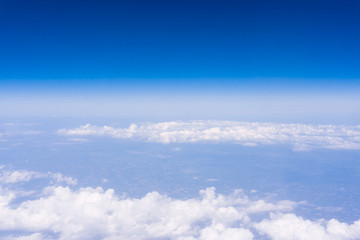 Fototapeta na wymiar skyline view above the clouds from air plane