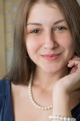 Naklejka premium Portrait of a cute girl in a blue dress