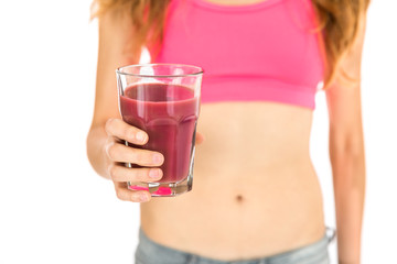 Healthy lifestyle woman showing a glass of pink smoothie