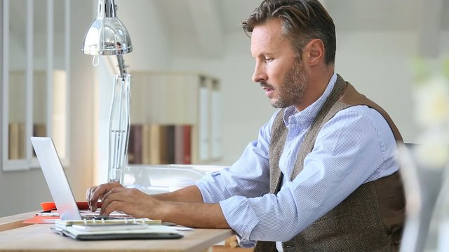 Man working on laptop computer