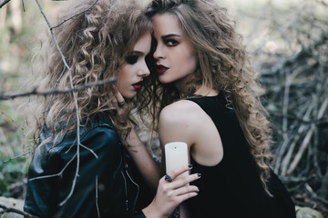 Two vintage witches gathered eve of Halloween