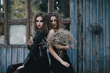 Two vintage witches gathered eve of Halloween