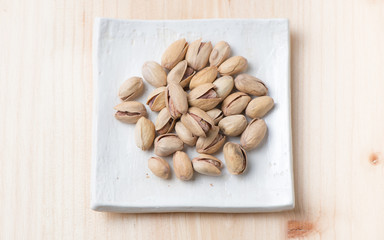 pistachio nut on wood background