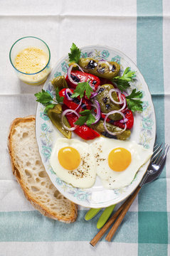 fast snack with eggs and fresh hot salad