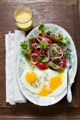 fast snack with eggs and fresh hot salad