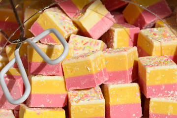 Bright colorful fudge for sale at market stall 