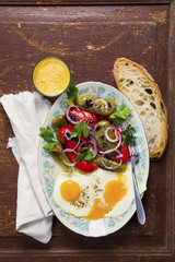 Breakfast with eggs and vegetables. Salad of sweet pepper. bread