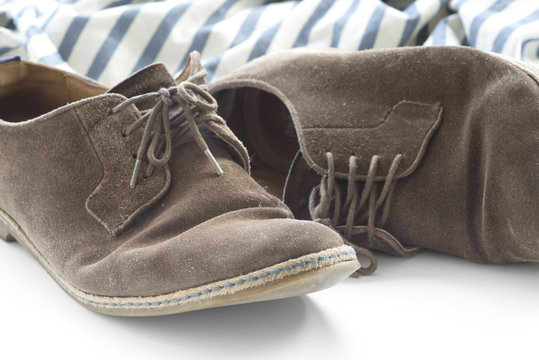 Brown shoes and striped shirt.