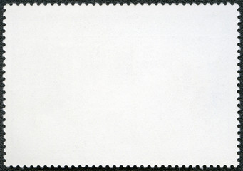 Blank postage stamp on a black background