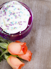 Colorful jelly with whipped cream and candy topping