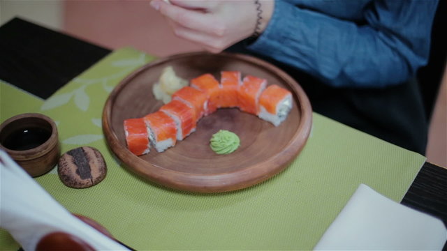 Two girls eating sushi