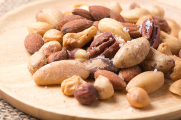 mix of various nuts on wood background