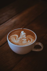 Cup of coffee latte art in coffee shop