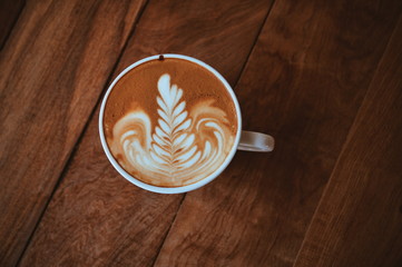Cup of coffee latte art in coffee shop