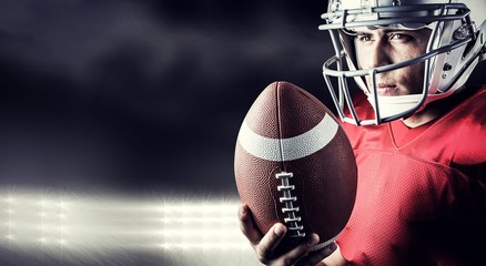 Composite image of confident american football player with ball © vectorfusionart