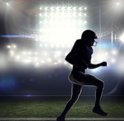 Fototapeta na wymiar Composite image of silhouette american football player runing