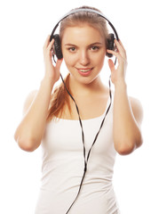 Naklejka premium Woman with headphones listening music . Music teenager girl isol