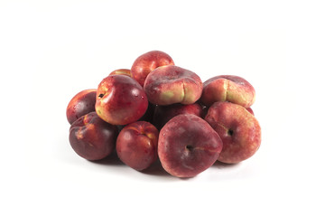 Fresh ripe red peaches with water drops isolated on white