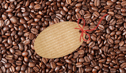 Close-up of coffee beans background and blank tag