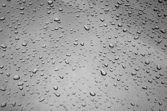 Raindrops on gray surface